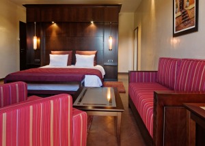 Superior single with garden view, balcony, private facilities (bath and shower), and breakfast